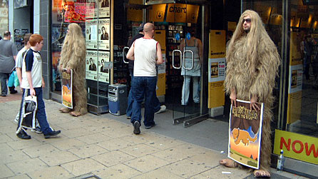 Men in SFA's yeti costumes outside a Cardiff record shop, 2003