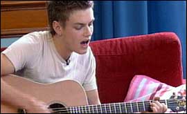 Gary singing with his guitar