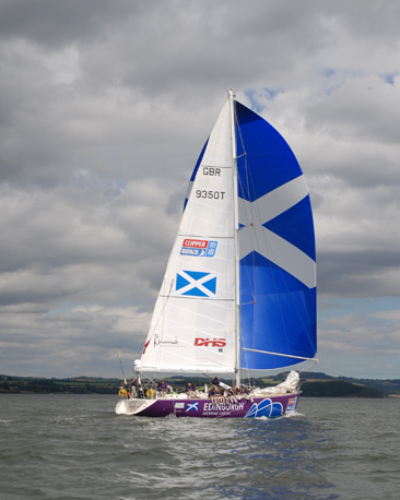 Edinburgh Inspiring Capital flying a Saltire spinnaker on the River Forth