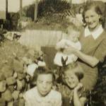This is me (bottom left) with my Auntie Muriel who is holding my cousin Ken and my other cousin Norma outside our air-raid shelter in Courtney Street, Swansea before we were bombed out in Feb 1941