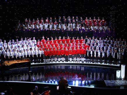 All six choirs stand in rows