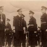 King George VI inspecting a guard of honour on HMS Queen Elizabeth