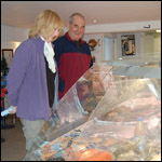 Two people looking at seafood