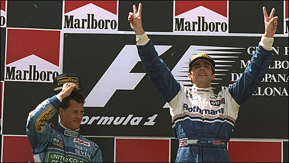 Damon Hill celebrates his win at the 1994 Spanish Grand Prix, with Michael Schumacher alongside him after finishing second