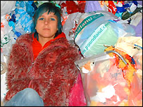 Anna surrounded by plastic bags