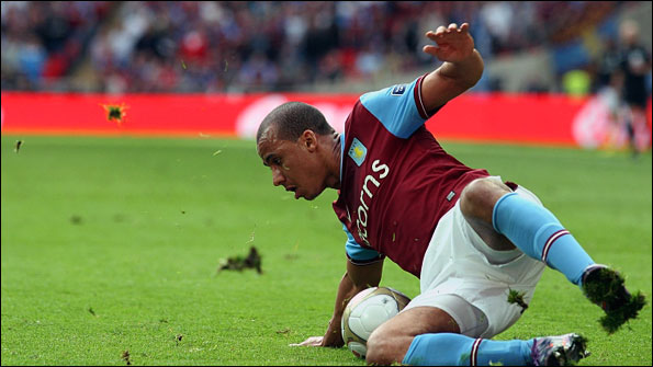 Aston Villa's Gabriel Agbonlahor slips on the Wembley pitch on Saturday