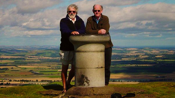 Two men standing at the top of East Lomond