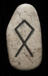 Rune stone with othalan, the letter O, marked on it