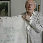 Bill Spry in 2005 with the kit bag he brought home with him from the Far East sixty years before