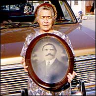 Petra holding a photo of Arthur Greenhalgh