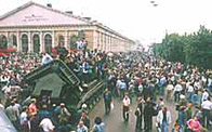Photo of Cold War demonstrators standing on a Soviet tank, 19 August 1991