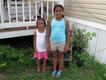 Isabella (left) next to Mary-Catherine, cousins at their grandparents' home. 