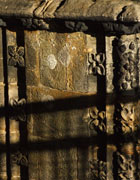 Small flowers carved down the edges of stone blocks