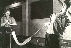Workers shaping glass