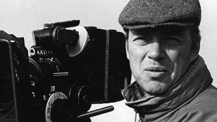 Black and white photograph of Endaf Emlyn with a camera