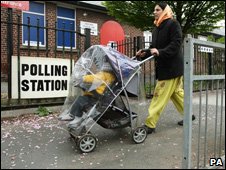Mother and child at polling station