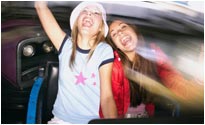 Girls on a fairground waltzer