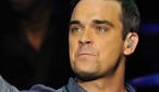 Robbie Williams performs at BBC Electric Proms 2009