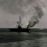 HMS Indomitable ablaze. 12th August 1942