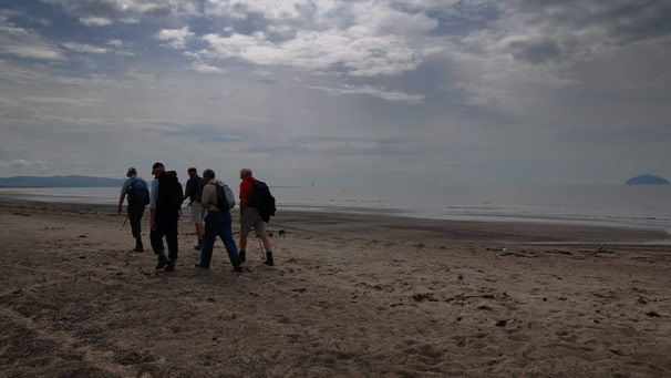 Walking along beach with Ailsa Craig in the background