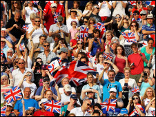 Spectators waving union jacks and applauding at London's Olympic Games 