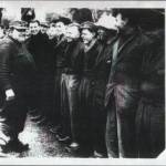 Chief Petty-Officer "Tubby" Cock "entertaining" the survivors of HMS Hardy and other ships at Horse Guards Parade