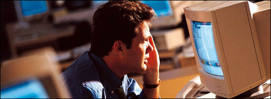 A man looking stressed at work