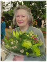 Marian Foster holding a bouquet of flowers