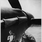 IAN ADAMSON WOODPECKER ARTIST AND FIGHTER PILOT WITH 136 SQUADRON PAINTING THE WOODPECKER SQUADRON EMBLEM ONTO A HURRICANE IIB.