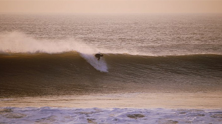 A lone surfer takes on a large wave yesterday in Porthcawl. Image by Gull