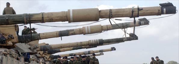 Officer cadets from the British Army take part in a training exercise (codename Operation Wessex Warrior) on Salisbury Plain, Wiltshire, 18/10/2006. They are seen here standing next to Challenger 2 tanks.