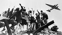 Berlin children wave to a blockade relief plane, 8 July 1948