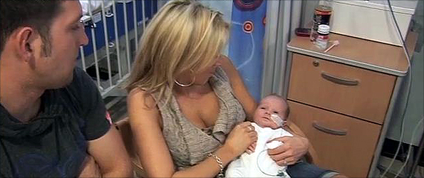 Baby Ashton with his parents before a heart operation