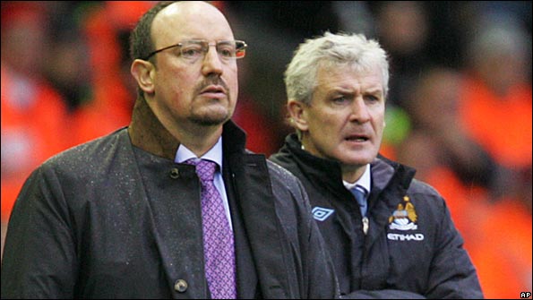 Rafael Benitez and Mark Hughes watch from the sidelines