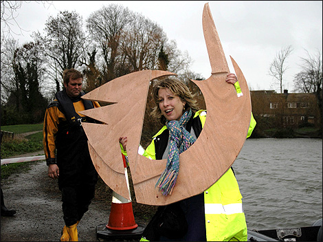 Woman holding large piece of wood