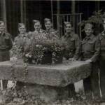 A little spot somewhere in the memorial wood. The lads examine the flowers and click goes the camera. Another snap for the album