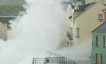 Early summer? More like January, and La Hinch man Tom Buckley finds the storm coming right in the front door of his surf shop. May 07