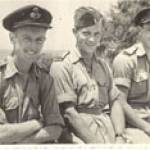 The photograph was taken at Tel Aviv Airport in 1947 and shows Harold Parkin on the left and Ted Rowbotham on the right with an unknown comrade in the middle.