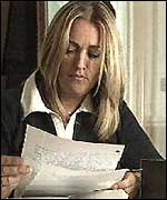 Sarah El Madawi reading a letter