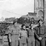 Bert Arrowsmith is on the left, next is Denis Knight, and Tom Denning on the far right; next to their Sherman in Bremen in April 1945.