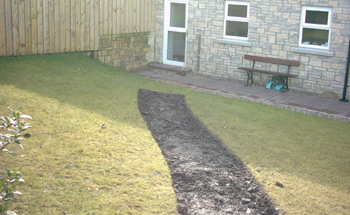 A view from the top of the garden to the back of the house 
