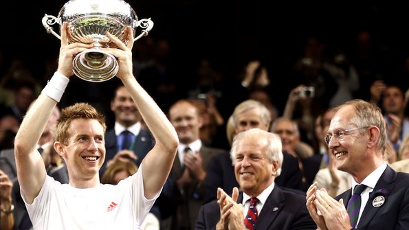 Jonathan Marray lifts his winners trophy at Wimbledon 2012.