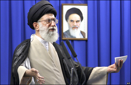 Iran's supreme leader Ayatollah Ali Khamenei delivers his sermon in front of a picture of the late spiritual leader Ayatollah Khomeini, during the Friday prayers at the Tehran University campus in Tehran, Friday June 19, 2009
