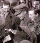 Photo of officers reading out news of the armistice to their men