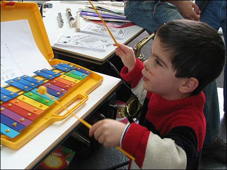 Ethan plays the xylophone.