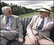 Mick Stanley and Maxwell Craven in a vintage car