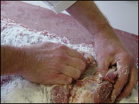 rubbing salt into meat 