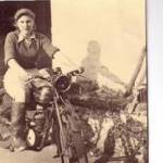 This is Jean on her motorbike in Norfolk wearing her Land Army clothes. Note the blackout on the headlight. Because of this she fell off in the dark and bore the scar forever.