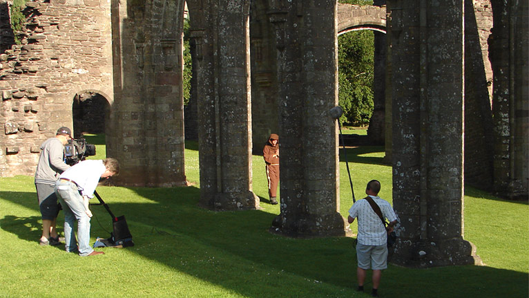 The crew filming inside the priory