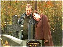 Couple at grave side